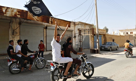 Isis supporters waving flag on motorcycle in Tabqa