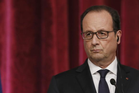 France's President Hollande attends a joint news conference at the Elysee Palace in Paris