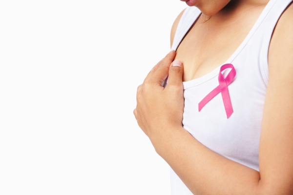 alt="woman wearing cancer foundation pink ribbon"