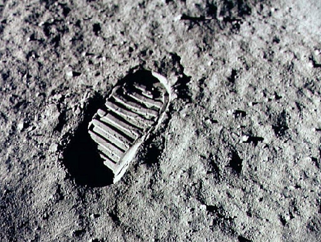 alt="Neil Armstrong steps into history in lunar dust"
