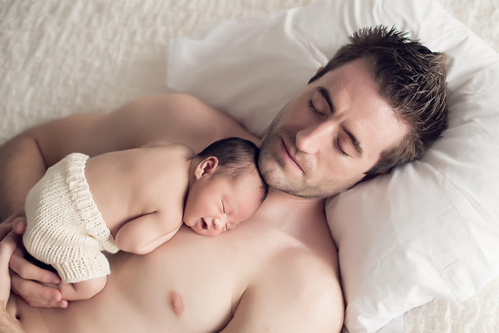 "father sleeping with baby"