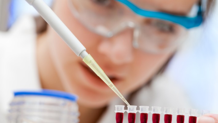 alt="researcher performs blood tests"