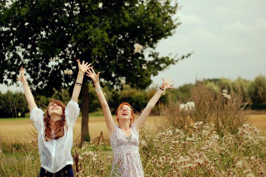 alt="Two Redhead Girls Happy in a Field"