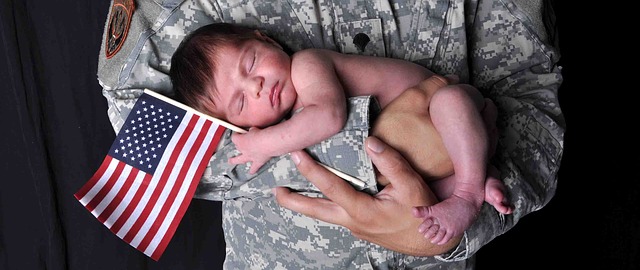 "Photo taken of a soldier holding his child."