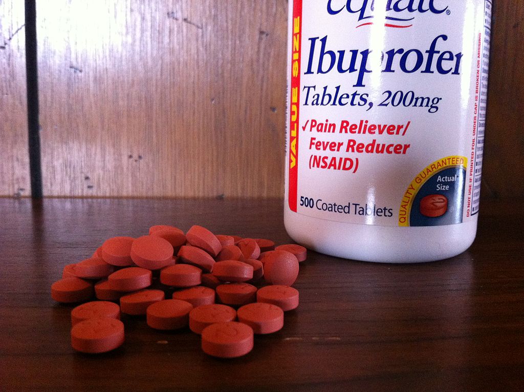 bottle of Ibuprofen and pills