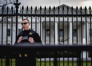 Secret Service agent standing guard outside the White House