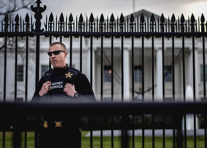 Secret Service agent standing guard outside the White House