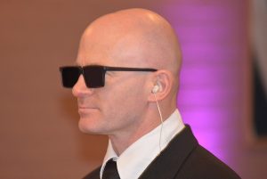 Bald man wearing sunglasses