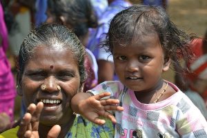 Indian grandmother holding grandchild