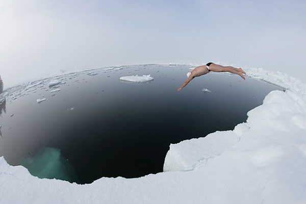 Swimmer Plunging into ice-cold water
